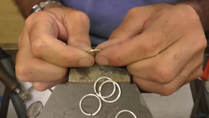 Prepare for soldering: Overlap and align the ends of each ring, ready for soldering. Add small pieces of hard solder to each joint.
