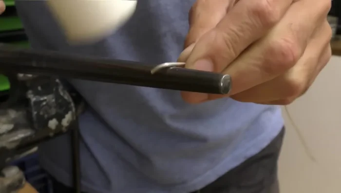 Wrap the wire around the mandrel: Wrap the wire around the mandrel to the desired size (slightly smaller than the final ring size).