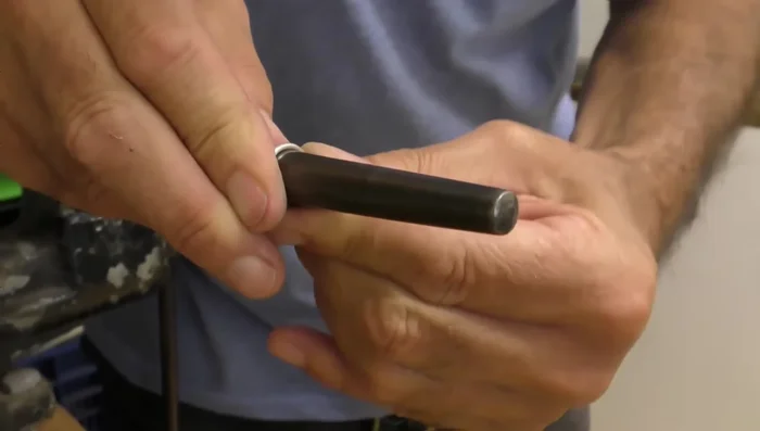 Wrap the wire around the mandrel: Wrap the wire around the mandrel to the desired size (slightly smaller than the final ring size).