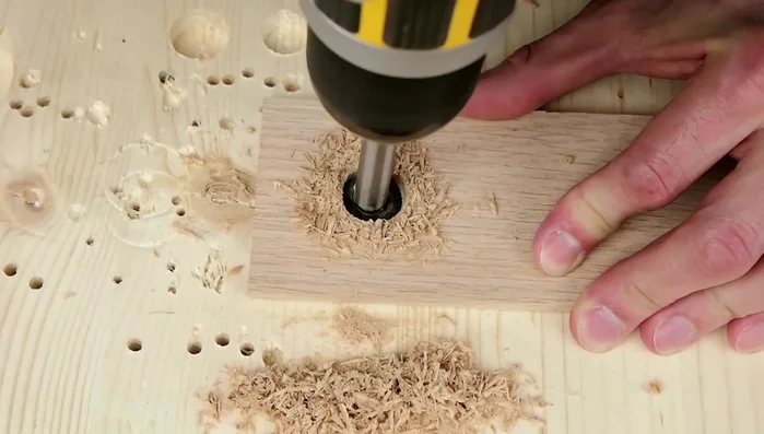Clamp the two pieces of wood together to form a mold.