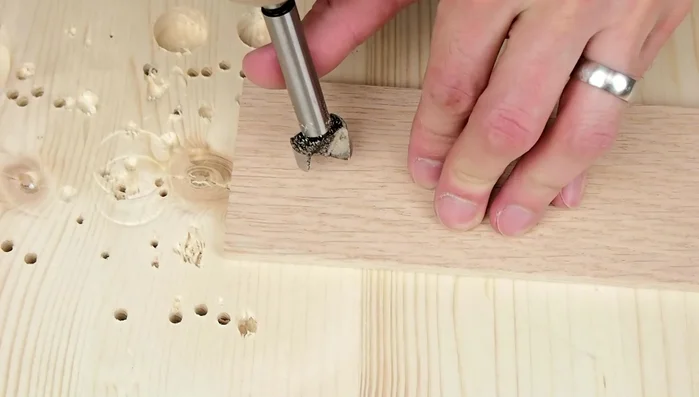 Clamp the two pieces of wood together to form a mold.