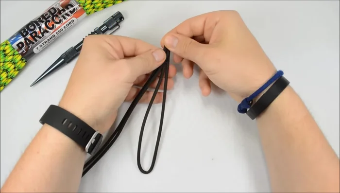 Create the initial loop: Fold the cord at the measured length, creating a loop for the bracelet closure. You will have two working ends.