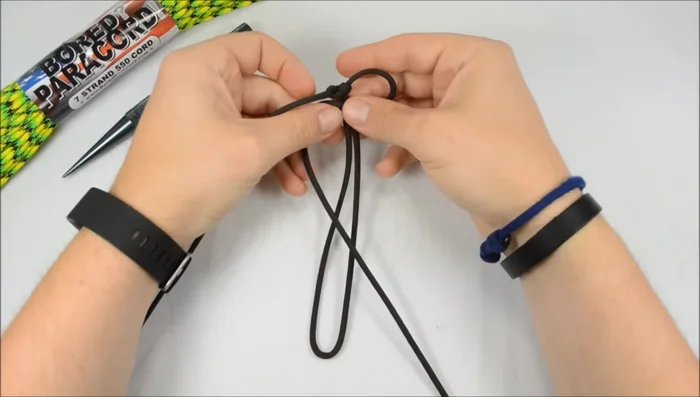 Continue the Cobra stitch: Continue the Cobra stitch down the length of the bracelet, ensuring the cord that went over the middle last time always goes over the middle again.