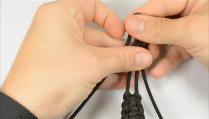 Adjust the stopper knot: If the stopper knot is too far out, loosen the bracelet and work the knot down to the desired position.