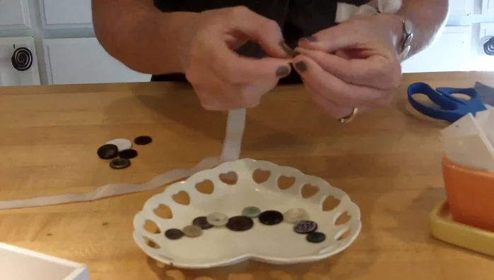 Thread the ribbon onto the collapsible needle.