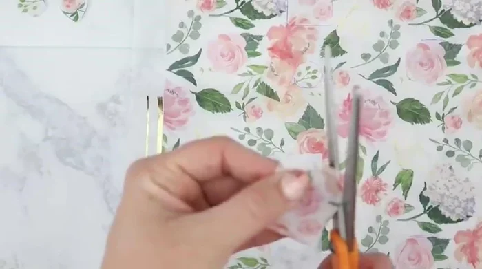 Carefully cut out the traced napkin pieces, ensuring no ink remains on the napkin.