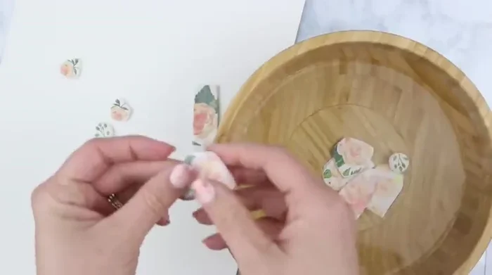 Gently rub the softened napkin off the clay using a washcloth.