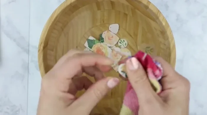 Gently rub the softened napkin off the clay using a washcloth.