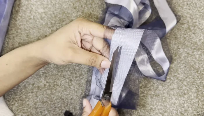 Trim excess tool: Carefully cut away the excess tool from the back of the anklet, leaving space for the elastic channel.