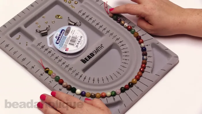 Cut the desired length of beading wire (adding extra for crimping). Attach a bead stopper approximately two inches from one end.