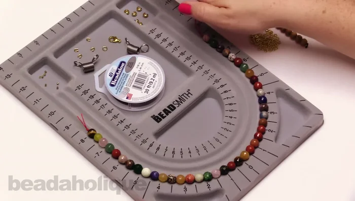 Cut the desired length of beading wire (adding extra for crimping). Attach a bead stopper approximately two inches from one end.