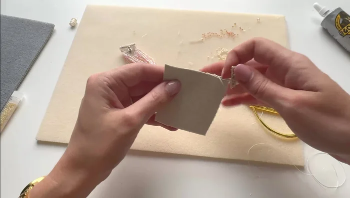 Glue the synthetic leather piece to the back of the felt, ensuring all edges are secured. Trim any excess material.