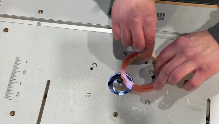 Chamfer the edges of the bracelets using a router table.