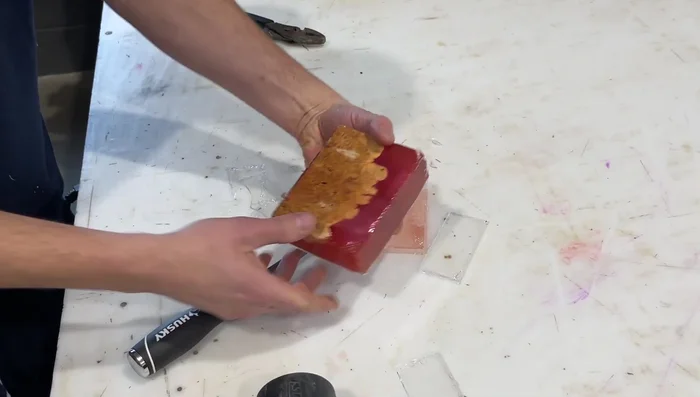 Remove the cured resin block from the mold.