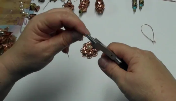 Attach to earring wire (or other finding): Thread the earring wire (or pendant bail) through the loop. Crimp the wire securely to prevent movement.