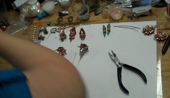 Assemble the flower: Attach flower components (cups, petals, etc.) to the squiggly wire.