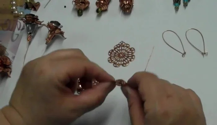 Attach to earring wire (or other finding): Thread the earring wire (or pendant bail) through the loop. Crimp the wire securely to prevent movement.