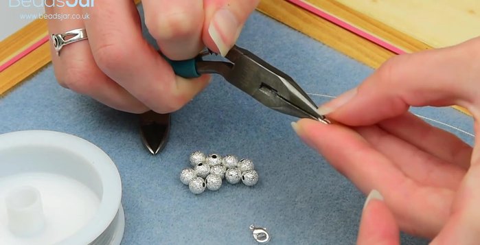 Attach the other end of the jump ring to the wire.