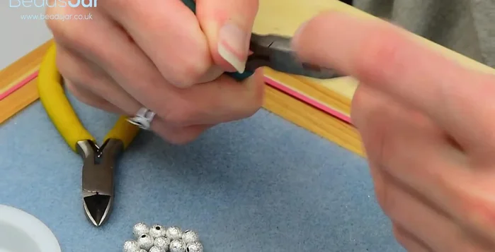 Attach the other end of the jump ring to the wire.