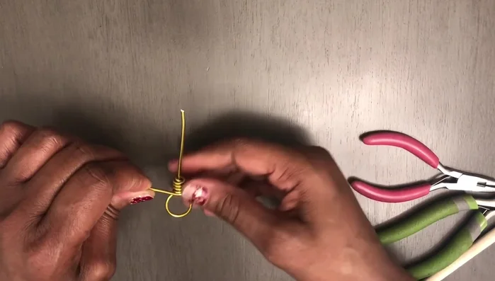 Create five loops along the wrapped wire. Aim for the central loop to be in the middle of your initial large loop.