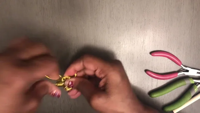 Use a dowel to form a loop at the top of the earring, then cut off the excess wire.