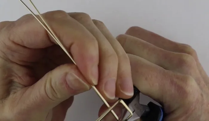 Separate and refine: Separate the wires and adjust the bends to ensure symmetry and evenness.