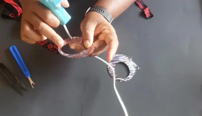 When nearing the end, fold in both the front and back edges of the fabric.