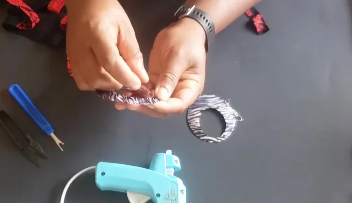 When nearing the end, fold in both the front and back edges of the fabric.