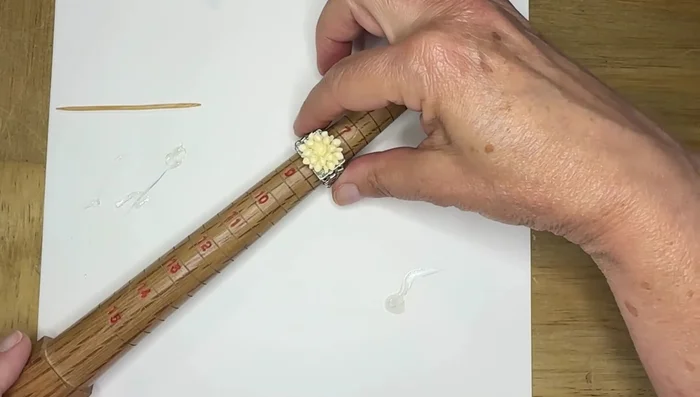 Set the ring aside to let the glue dry completely. For larger cabochons, optionally use a ring mandrel to help maintain the shape during drying.