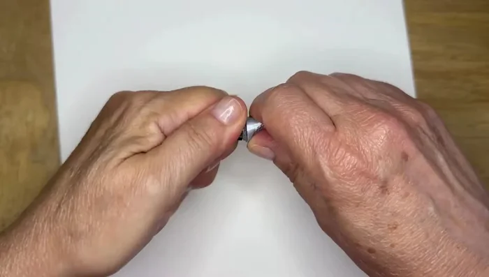 Spread the glue slightly around the center.