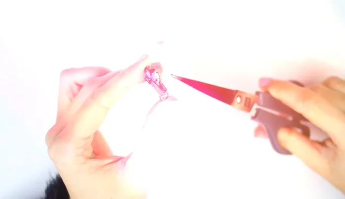 Use a wide pusher to secure the earring backing.