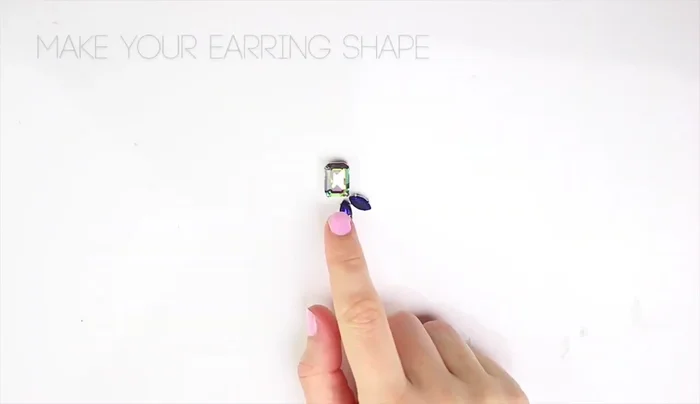 Secure the rhinestones with scotch tape, maintaining their shape.