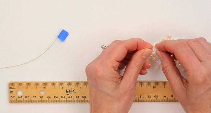 Continue stringing pearls until you have a total of 16 inches.