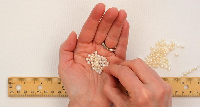 Continue stringing pearls until you have a total of 16 inches.