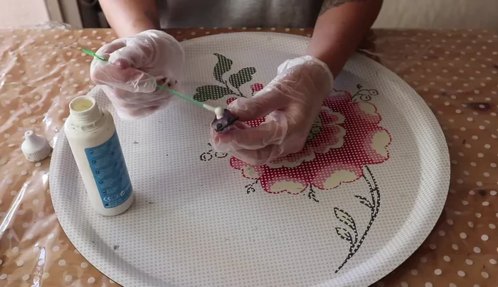 Apply liquid latex to areas of the crystal you don't want copper to form on.