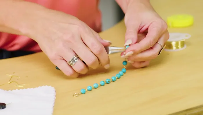 Attach the other half of the clasp to the final connector.