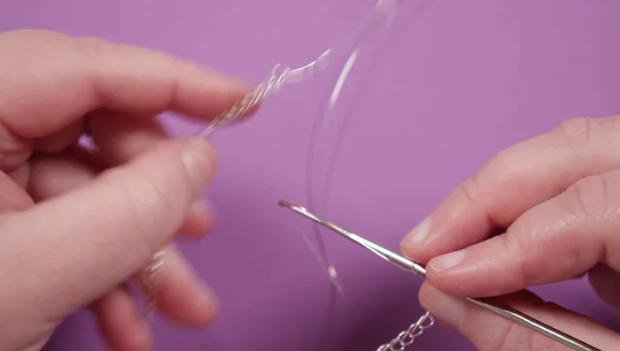 Connect the last loop of the long row to the first loop of the new row using a loop.