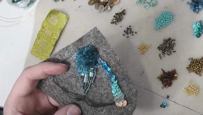 Add rows of beads to create spotted accents, using couching to secure.