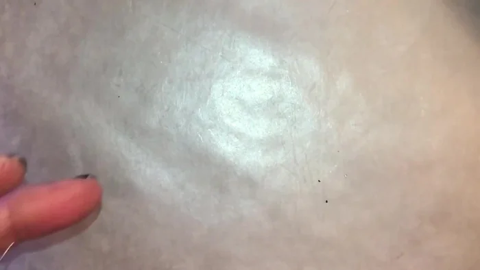 Wrap the two small wire tails around the twist at the top of the teardrop. Cut off excess wire close to the twist.