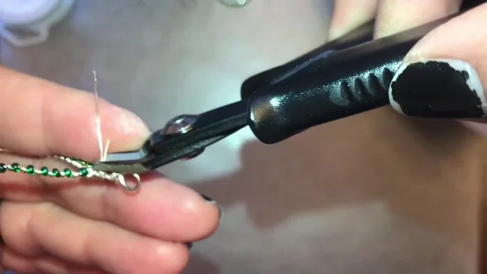 Tuck in the extra wire at the end of the spiral. Use pliers to secure it. Smooth out any pointy bits.