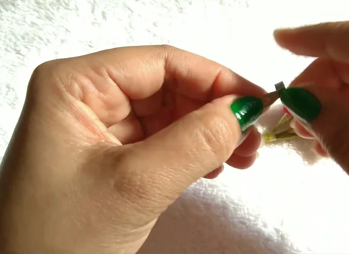 Stick, turn A inside, stick, cut U, place on top, stick on back.