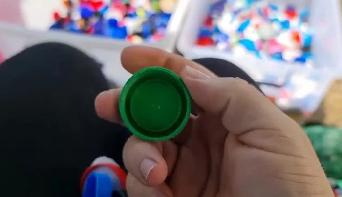 Sort bottle caps by plastic type (LDPE, HDPE, PP) and color.