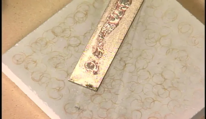 Clean the metal in a pickle (mild acid solution) to remove flux and oxidation.