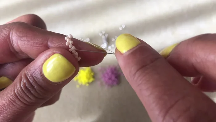 Continue Peyote stitch, adding a bead between each 'up' bead. The number of beads per row will vary (five, then four, etc.)