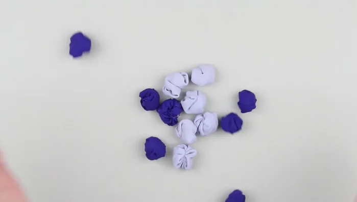 Thread decorative pins through big plastic beads, making loops.