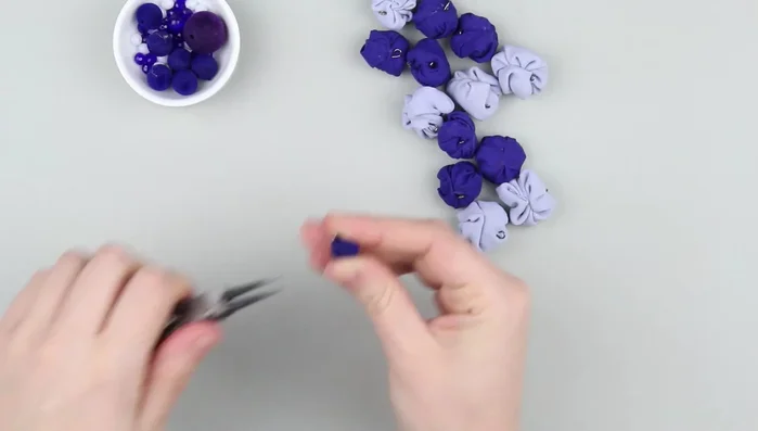 Thread the string through small plastic beads, securing each with knots.