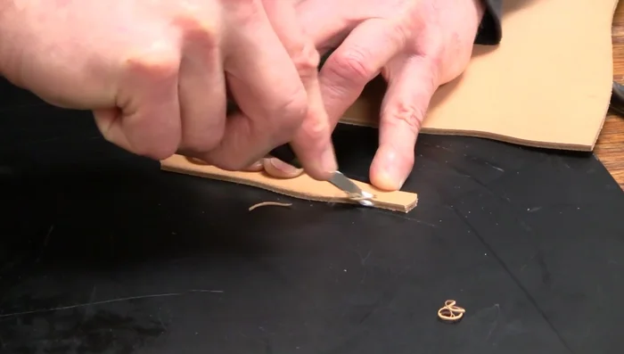 Cut the Ring: Cut out the leather ring using a sharp knife. (Cutting shown from 195.599).