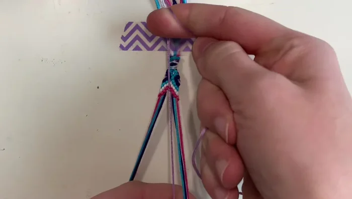 Center diamond squares: Create small diamond shapes in the center using alternating forward and backward knots.