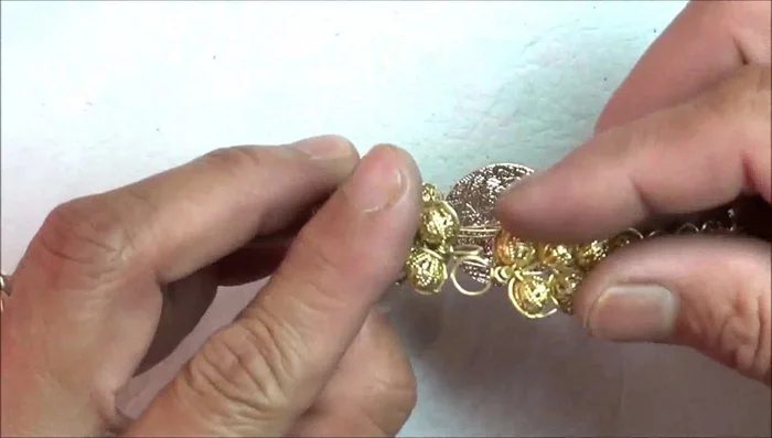 Adjust and finish: Adjust the bracelet's length as needed. Secure all ends of the wire by wrapping and tucking them neatly. Straighten any kinks or bends in the finished bracelet.