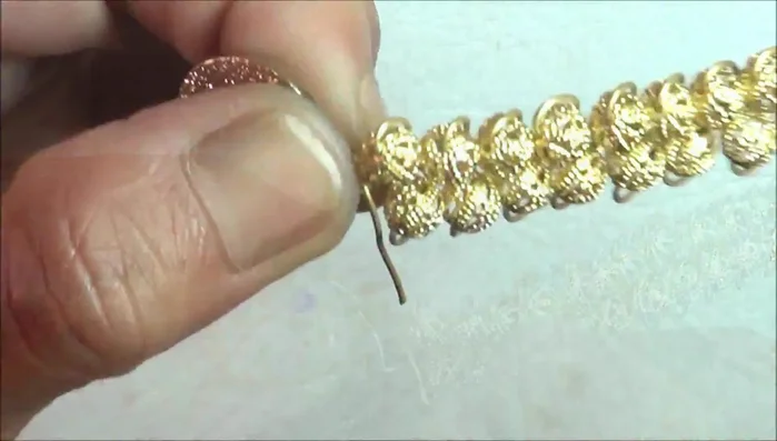 Attach to the disc: Create a small loop at the end of each wire and attach them to the 22mm disc. Secure by wrapping the wire around several times.